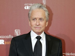 FILE - In this Feb. 26, 2016 file photo, U.S actor Michael Douglas arrives at the 41st French Cesar Awards Ceremony, in Paris. A woman who worked for Douglas in the late 1980s says he fondled himself in front of her, an allegation the actor has vigorously denied. Journalist and author Susan Braudy appeared Friday, Jan. 19, 2018 on NBC's "Today" show. Earlier this month, Douglas said he anticipated an upcoming report containing allegations and called it a "complete lie, fabrication."