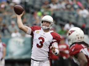FILE - In this Sunday, Oct. 8, 2017 file photo, Arizona Cardinals' Carson Palmer throws during the second half of an NFL football game against the Philadelphia Eagles in Philadelphia. Arizona Cardinals quarterback Carson Palmer is retiring after 15 NFL seasons. Palmer, who turned 38 last week, made the announcement in an open letter released by the Cardinals, Tuesday, Jan. 2, 2018.