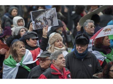 Several different groups crowded the steps of the Vancouver Art Gallery to rally in support of recent unrest in Iran.