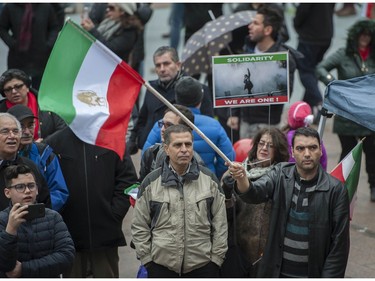 Several different groups crowded the steps of the Vancouver Art Gallery to rally in support of recent unrest in Iran.