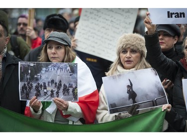 Several different groups crowded the steps of the Vancouver Art Gallery to rally in support of recent unrest in Iran.