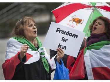 Several different groups crowded the steps of the Vancouver Art Gallery to rally in support of recent unrest in Iran.