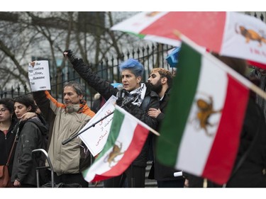 Several different groups crowded the steps of the Vancouver Art Gallery to rally in support of recent unrest in Iran.