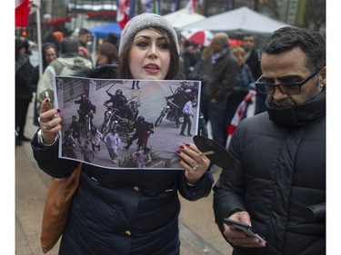 Several different groups crowded the steps of the Vancouver Art Gallery to rally in support of recent unrest in Iran.