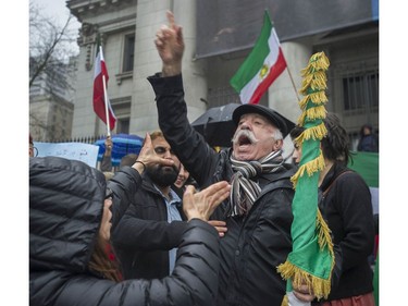 Several different groups crowded the steps of the Vancouver Art Gallery to rally in support of recent unrest in Iran.