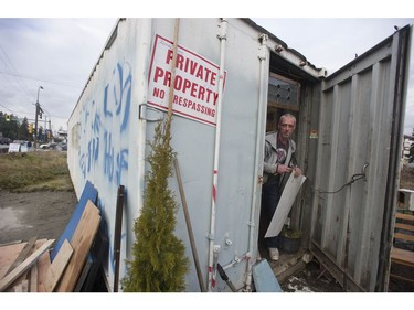 Jay Post works on the  home he made from a shipping container.