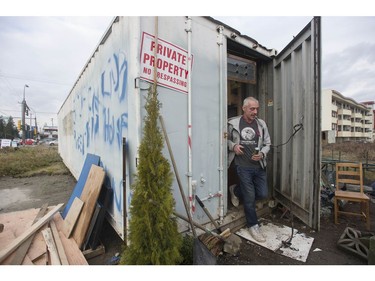 Jay Post works on the home he made from a shipping container.
