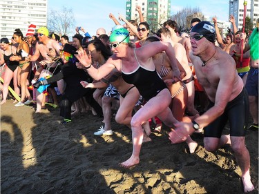 Participants in the 98th annual Polar Bear Swim in action at English Bay in Vancouver, BC., January 1, 2018.