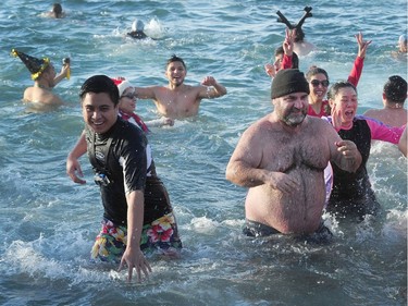 Participants in the 98th annual Polar Bear Swim in action at English Bay in Vancouver, BC., January 1, 2018.