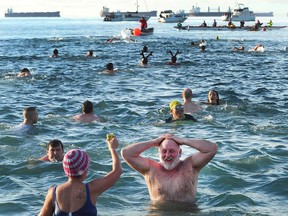 Participants in the 98th annual Polar Bear Swim in action at English Bay in Vancouver on January 1, 2018.