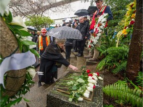 Friends, family and dignitaries pay tribute to four construction workers at the Burrard Street SkyTrain Station in Vancouver on Jan. 8. The men died Jan. 7, 1981, from a fall from the 36th floor of the Bentall IV tower.