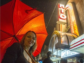 Corinne Lea stands in front of the the refurbished sign at the Rio Theatre on Broadway in Vancouver, B.C..
