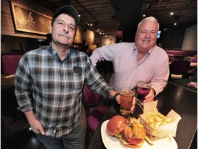 Chef Jim Romer (left) with partner Kelly Gordon at Romer's Burgers in Vancouver. Romer has implemented four-day, 10-hour work weeks for his staff in order to battle a shortage of workers in the restaurant industry.