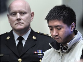 Wilfred Wong, brother of shooting victim Alfred Wong, at a press conference with Chief Const. Adam Palmer in Vancouver, Jan. 22, 2018.