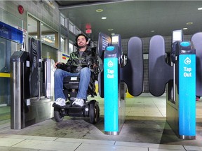 Omar Al-azawi tries the new accessible gate at the Sperling-Burnaby Lake SkyTrain Station. The system is based on a radio-frequency identification (RFID) which sends a signal to open the gate.