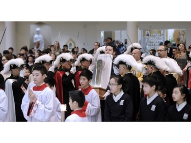 The relic of the forearm and hand of Jesuit priest St. Francis Xavier is carried in to St. Francis Xavier Church in Vancouver