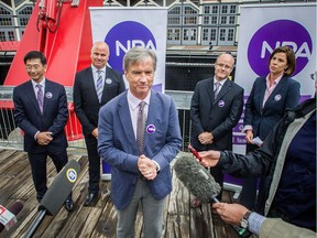 The NPA has opened its nomination period to seek its next mayoral candidate. In this July 2014 file photo, Ken Low, Rob McDowell, Gregory Baker and Suzanne Scott (left to right, back row) are introduced as NPA council candidates by NPA's mayoral candidate Kirk LaPointe (center) at the Yaletown Roundhouse in Vancouver, B.C.