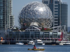 A kayaker takes to the waters of False Creek under blue skies in Vancouver. Environment Canada says Wednesday's weather will be a mix of sun and cloud.