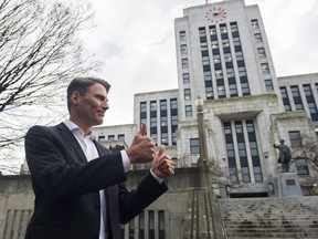 Mayor Gregor Robertson gestures to a constituent prior to addressing the media after his announcement that he will not run for reelection, Vancouver, January 10 2018.  Gerry Kahrmann  /  PNG staff photo) ( Prov / Sun News ) 00051977A  [PNG Merlin Archive]