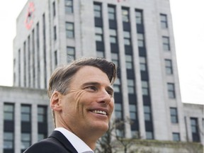 Mayor Gregor Robertson leaves a news briefing after his announcement that he will not run for re-election, on Jan. 10 in Vancouver.