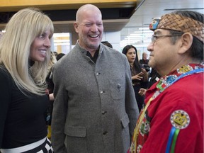 Shannon and Chip Wilson speak to Elder in Residence Lekeyten, of the Kwantlen First Nation, during the opening of the Wilson School of Design at Kwantlen Polytechnic University in Richmond on Jan. 3 2018.