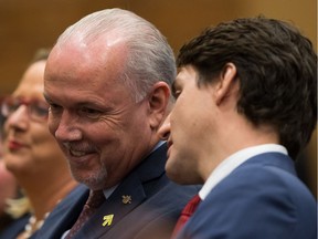 B.C. Premier John Horgan, left, and Prime Minister Justin Trudeau have discussed July deadlines about cannabis legalization, one of the many things Horgan hopes to accomplish in 2018.