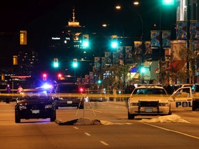 Shooting victim Raj Soomel lies in the middle of Cambie Street at 19th Avenue in Vancouver, Tuesday evening, Sept. 30, 2009.