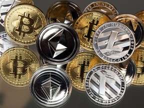 A collection of bitcoin, litecoin and ethereum tokens.