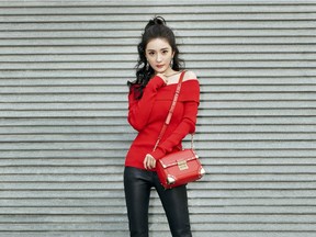 Chinese actress Yang Mi is an ambassador for Michael Kors. Mi wears the MICHAEL MICHAEL KORS Cori Small Leather Crossbody, $448.
