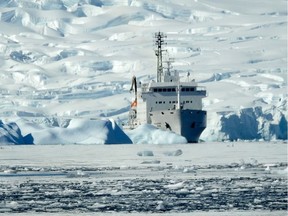 Slumping glaciers and sea ice appear to engulf the Akademik Ioffe on a sunny summer day in Fournier Bay, Antarctica in February 2018. (Daphne Bramham/PNG)