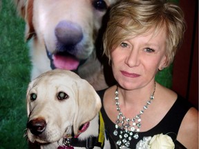 Six-week-old Labrador pup Rainbow spotted something of interest when Pacific Assistance Dogs Society executive director Laura Watamanuk held her at the PADS organization's second-annual fundraising gala.