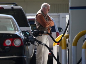 A Vancouverite gasses up his car.