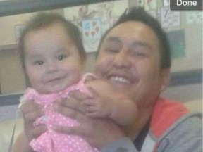 Robert Boucher was stabbed to death in 2015. He is shown with his then-infant daughter.