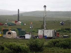 FILE - In this July 13, 2007 file photo, workers with the Pebble Mine project test drill in the Bristol Bay region of Alaska near the village of Iliamma. The Trump administration settled a lawsuit Friday, May 12, 2017, over the proposed development of a massive gold and copper mine at the headwaters of one of Alaska's premier salmon fisheries. The Environmental Protection Agency settled the long-running case with the Pebble Limited Partnership, agreeing to allow the Canadian-owned company to seek a federal permit to build its mine near Bristol Bay.