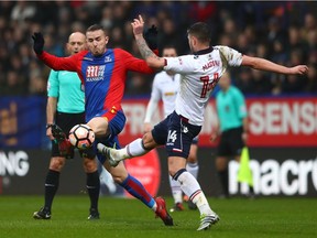 Jordon Mutch (red and blue jersey) in action in a January 2017 FA Cup match for Crystal Palace against Bolton.