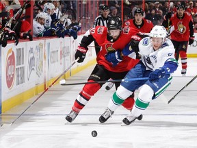 Troy Stecher of the Vancouver Canucks, beating Tom Pyatt of the Ottawa Senators to the puck in this battle, has proven that skill and quickness is a great equalizer for players not blessed with size.