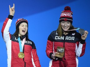 Gold medal winner Kelsey Serwa (left) and silver medallist Brittany Phelan — both of Canada —celebrate during the medal ceremony for women’s ski cross at the PyeongChang Winter Olympic Games on Friday in Pyeongchang-gun, South Korea. (Photo: Quinn Rooney, Getty Images)