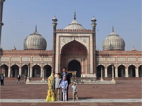 Canada's Prime Minister Justin Trudeau (C) poses with his wife Sophie Gregoire Trudeau (L), daughter Ella-Grace (2nd R), son Xavier (2nd L) and son Hadrien (R) during a visit to the Jama Masjid, one of India's largest mosques, in New Delhi on February 22, 2018. Trudeau and his family are on a week-long official trip to India.