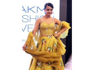 Indian Bollywood actress Surveen Chawla poses for a photograph at Lakmé Fashion Week (LFW) Summer Resort 2018 in Mumbai on February 2, 2018.