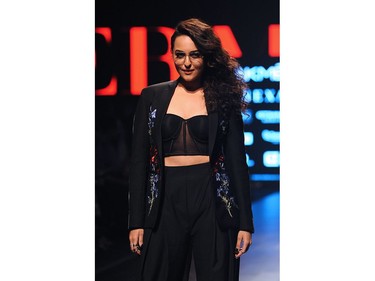 Indian Bollywood actress Sonakshi Sinha showcases a creation by designer Falguni Shane Peacock at the Lakmé Fashion Week (LFW) Summer Resort 2018 in Mumbai on February 2, 2018.