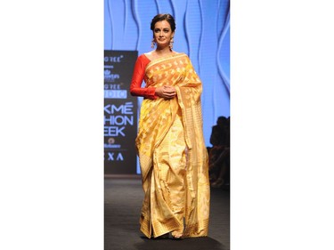 Indian Bollywood actress Dia Mirza showcases a creation by designer Sanjukta Dutta at the Lakmé Fashion Week (LFW) Summer Resort 2018 in Mumbai on February 3, 2018.