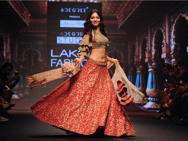 Indian Bollywood actress Dia Mirza showcases a creation by designer Sanjukta Dutta at the Lakmé Fashion Week (LFW) Summer Resort 2018 in Mumbai on February 3, 2018.