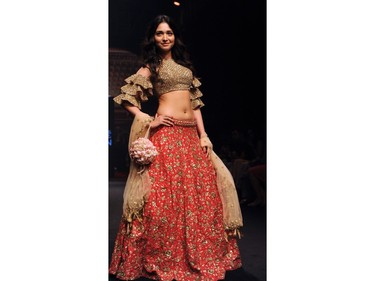 Indian Bollywood actress Dia Mirza showcases a creation by designer Sanjukta Dutta at the Lakmé Fashion Week (LFW) Summer Resort 2018 in Mumbai on February 3, 2018.