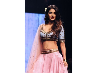 Indian Bollywood actress Nidhhi Agerwal showcases a creation by designer Suloka Sudhakar at the Lakmé Fashion Week (LFW) Summer Resort 2018 in Mumbai on February 3, 2018.