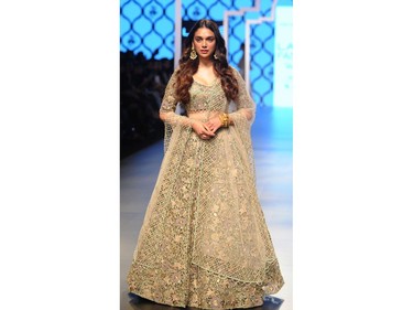 Indian Bollywood actress Aditi Rao Hydari showcases a creation by designer Payal Singhal at the Lakmé Fashion Week (LFW) Summer Resort 2018 in Mumbai on February 3, 2018.