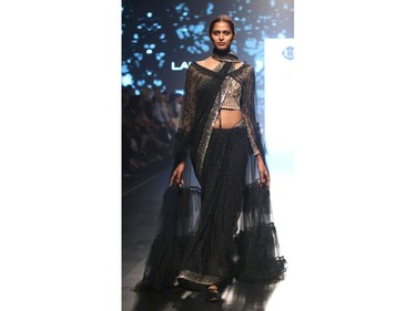 An Indian model showcases creations by designer Kotwara at the Lakmé Fashion Week (LFW) Summer Resort 2018 in Mumbai on February 3, 2018.