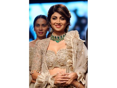 Indian Bollywood actress Shilpa Shetty showcases a creation by designer Jayanti Reddy at the Lakmé Fashion Week (LFW) Summer Resort 2018  in Mumbai on February 4, 2018