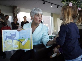 B.C. Finance Minister Carole James reads Pete the Cat, I Love My White Shoes to students at the Downtown Y Child Care Centre in Victoria on Monday, Feb. 19, 2018.
