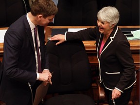 Finance Minister Carole James shares a laugh with Attorney General David Eby delivers the budget speech from the legislative assembly at Legislature in Victoria, B.C., on Tuesday, February 20, 2018.