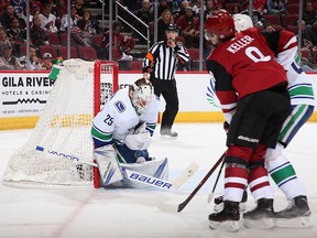 Jacob Markstrom makes an early save Sunday to backstop the Canucks to victory.